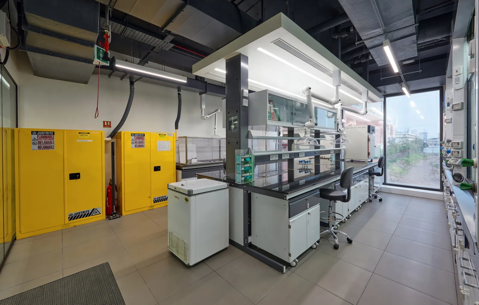 Chemistry laboratory with walk-in fume hood and flammable storage cabinets